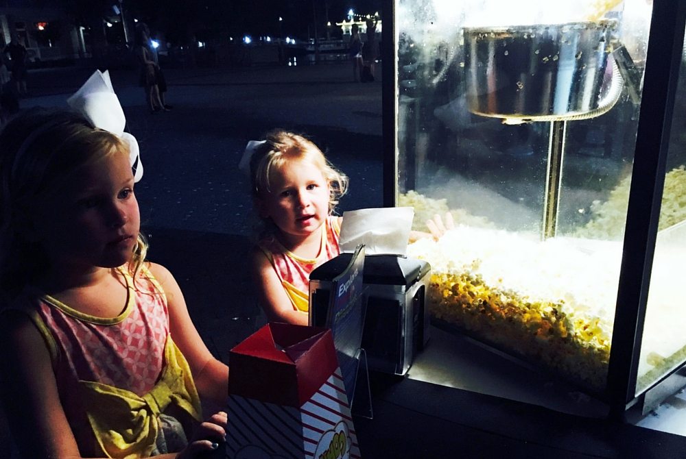 Movie goers enjoy popcorn at The Village of Baytowne Wharf's Sunday cinema. 