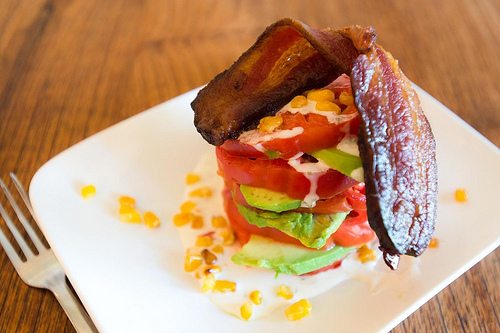 Tomato stack with candied bacon and avocado