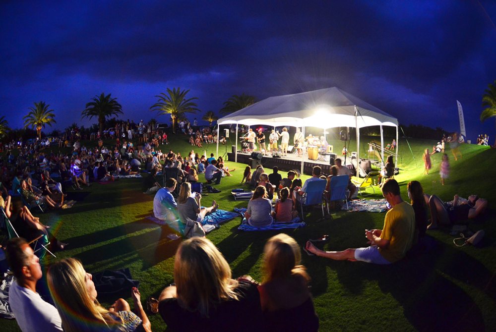 People gather for a Labor Day concert at Alys Beach