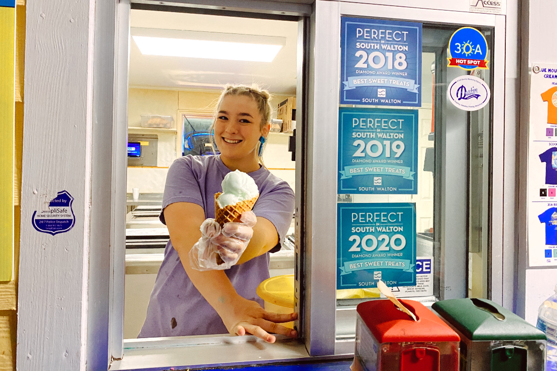 Girl serves ice cream cone at Blue Mountain Creamery