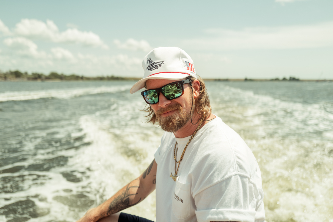 Brian Kelley rides on boat
