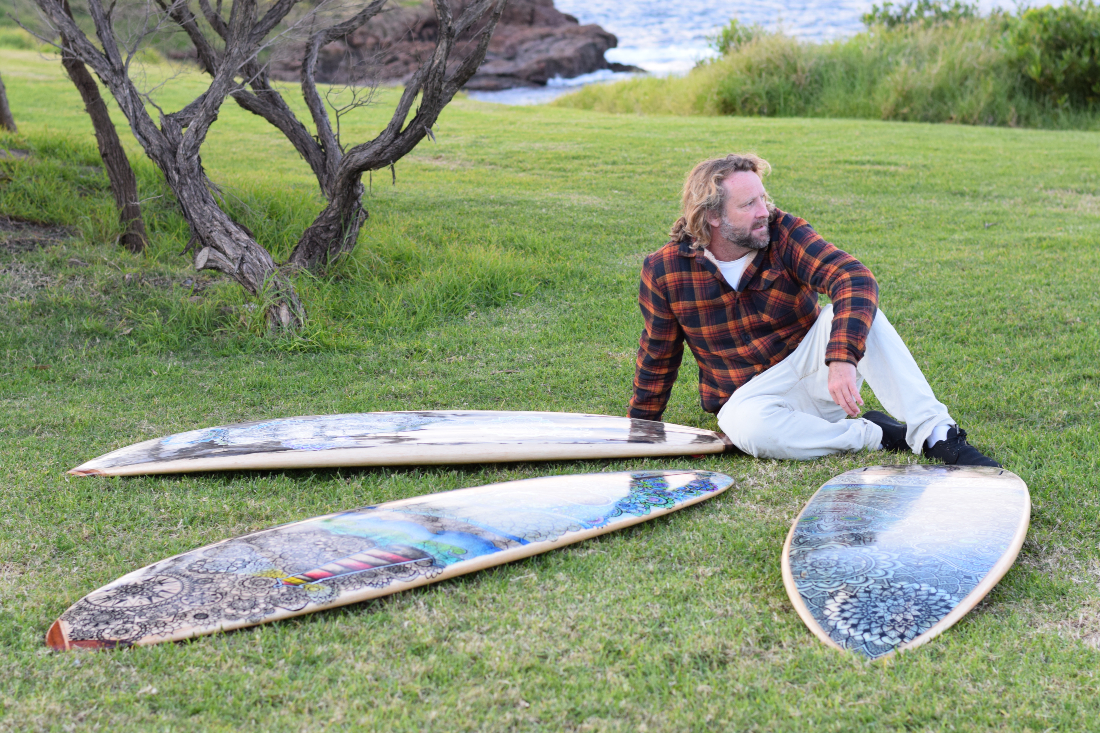 Gareth Smith poses with surfboards