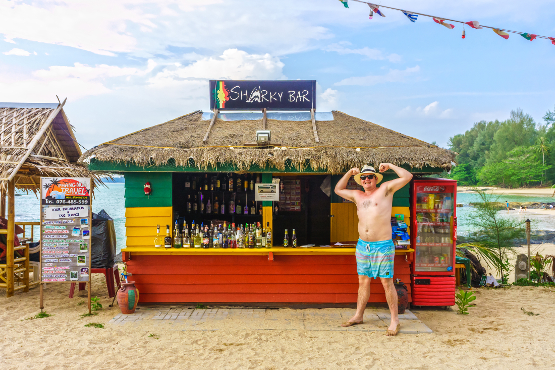 Man poses at Sharky Bar in Thailand