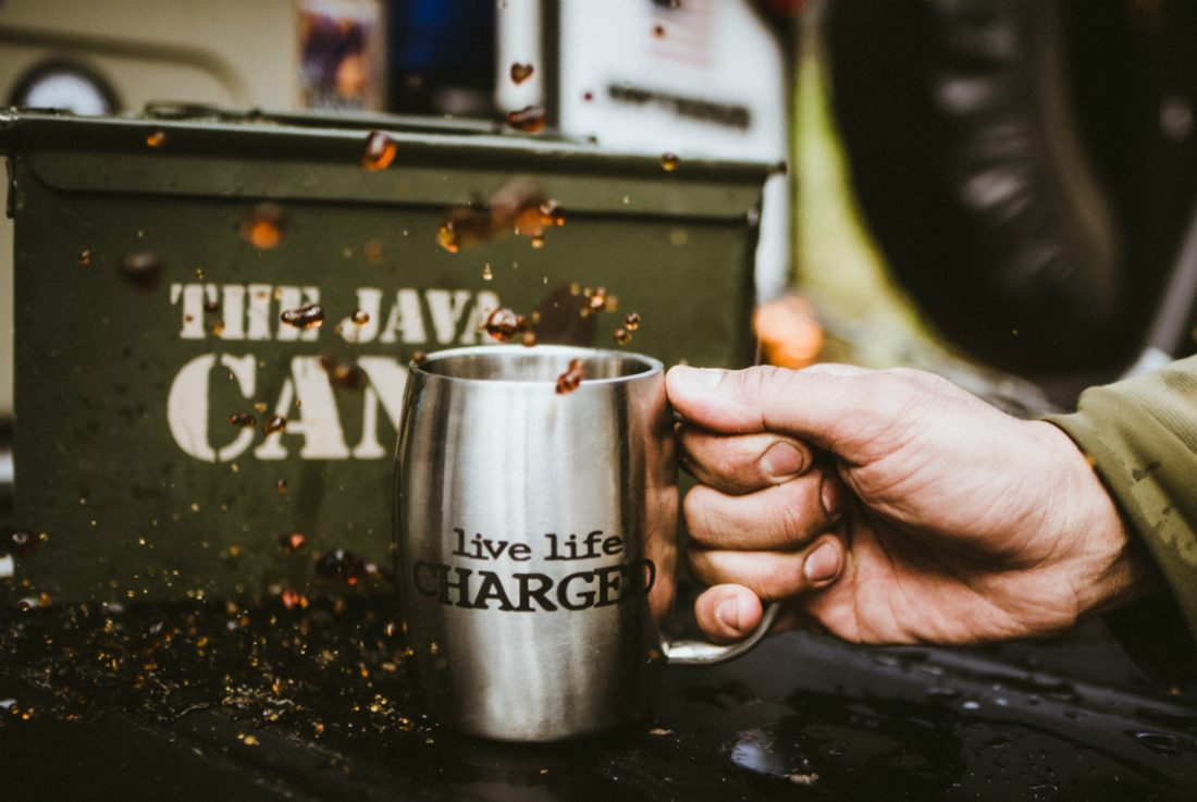 "Live life charged" cup with coffee